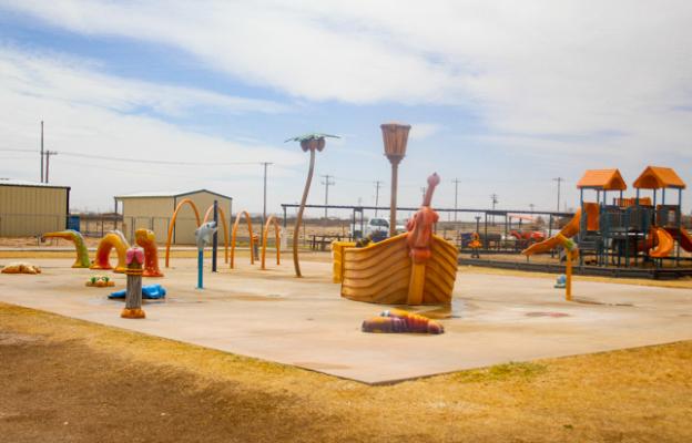 The water used by the current spray park in Gene Cummings Park could soon be conserved with a water reclamation system that will recycle water for irrigation. Photo by Nathan Heuer