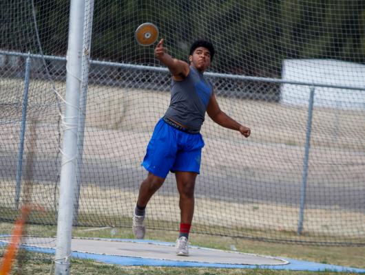 Elijah Escajeda competes in the discus competition at the Comanche Relays in 2021. The senior punched his ticket to the area meet for the first time in his career in the event last Saturday. File Photo