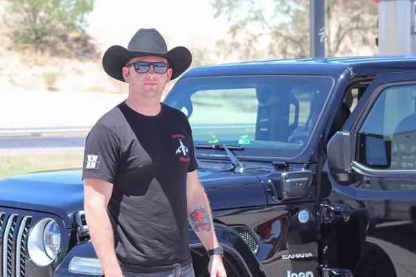 Josh of Fayetteville, North Carolina pulled off the I-10 to fuel up his black Jeep Wrangler Sahara. The traveler spared some time to discuss his travels and the neon rubber duckies on his dashboard. Photo by Jeremy Gonzalez