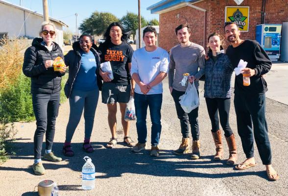From left to right: Jasmine, Tiara, William, Omar, John, Anna and Trevor. After a flamboyant parking lot dance party the group of seven indulged in some road-trip snacking. Photo by Jeremy Gonzalez
