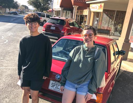 Seung and Sophi have been traveling for six months now. Coming out of a BMW with license plates that read “Spicie” the pair had just arrived to the Mesquite Tree coffee shop. Photo by Jeremy Gonzalez