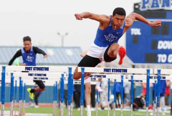 Zane Hodges, right, competes in the 110 hurdles during Saturday's Comanche Relays.