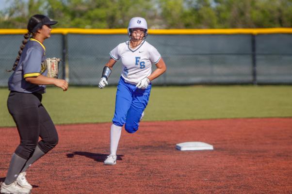 Mia Garcia extrudes a big smile as she rounds second base following her three-run homer against Seminole on April 11 at Prowler Field. Photo by Nathan Heuer
