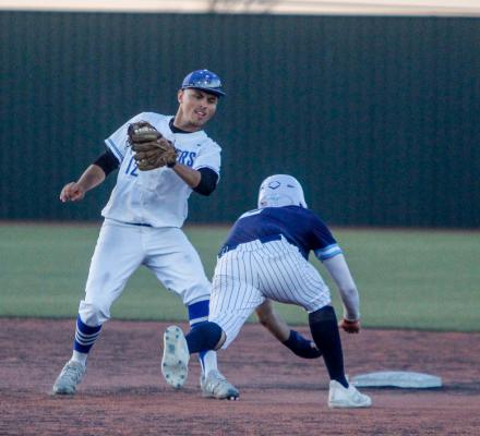 Alfredo Molina tags out a Greenwood base runner on an attempt steal during a home contest for the Panthers on April 18. Photo by Nathan Heuer