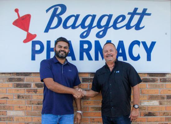 Baggett Pharmacy new owner Shashwat Patel, left, and former owner Mario Juarez, right, posed for a photo together on June 20 as a representation of the change of ownership that happened last week. Photo by Nathan Heuer