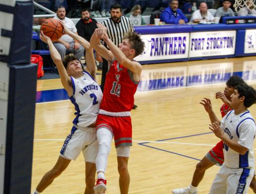 Fort Stockton's Caleb Garcia, left, attacks the rim against Denver City in the Panthers homestand on Dec. 14.