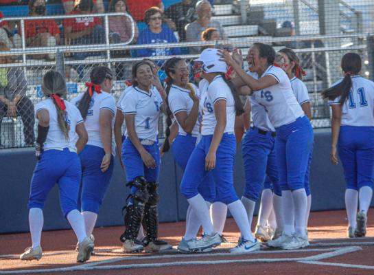 Fort Stockton’s Alyana Dominguez, right, Leilani Lopez (2), and Dmaya Vaughn (1) celebrate with teammate Mia Garcia, middle, after her home run in a home contest against Andrews on March 25. Garcia recorded a career-high nine RBIs in the Prowlers rout of Pecos on March 29. Photo by Nathan Heuer