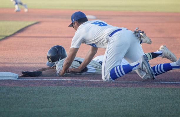 Fort Stockton's Dominic Bernal (5) tags an Andrews baserunner for an out on a pickoff attempt during the Panthers home game on March 25. Photo by Nathan Heuer