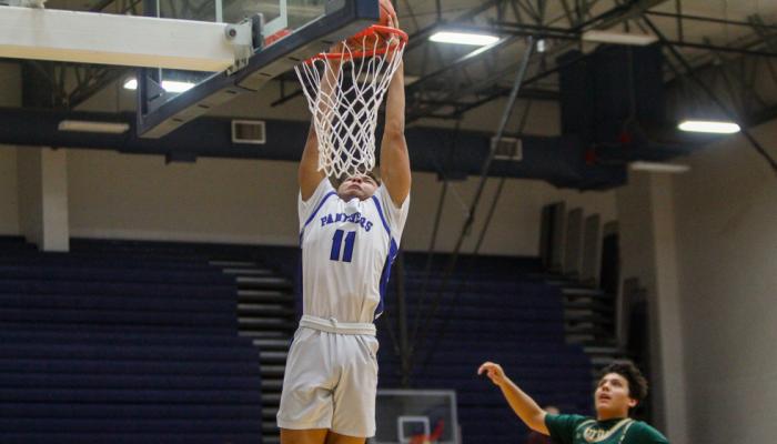 Senior highflyer Isaiah Garcia sends down a jam for the Panthers at the Special Events Center on Jan. 3 against Fort Stockton. The dunk was Garcia’s fourth of the season. Photo by Nathan Heuer