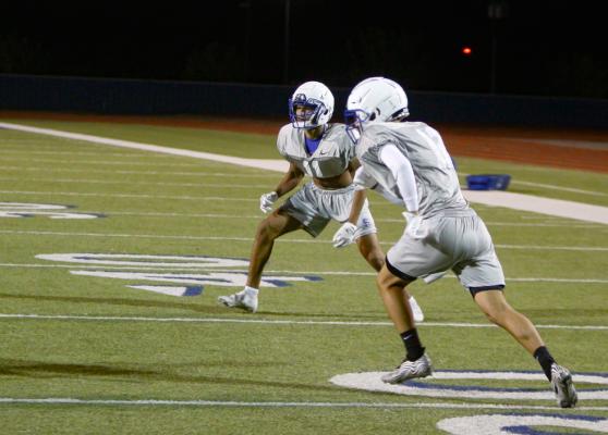 Senior and returning first-team all-district selection defensive back Isaiah Garcia (11) works his coverage skills during a defensive team drill that worked on the implementation of the scheme that head coach Jeremy Hickman and new defensive coordinator Benny Ellison brought to the program.