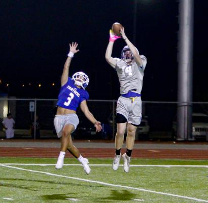  Kye Norman (14) skying for a catch during a 7-on-7 drill. The practice took place from 10 p.m. to 12:30 a.m. Photos by Nathan Heuer