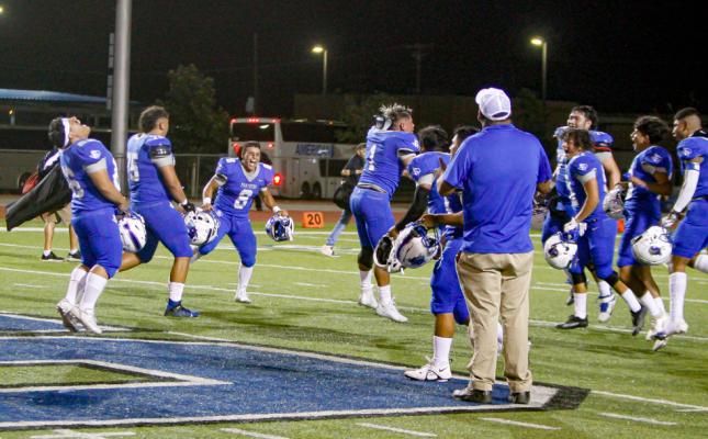 Senior linebacker Daren Ureste (1) cleanly landed a backflip as he celebrates the Panthers’ victory on Aug. 26 at Panthers Stadium against El Paso Austin. 