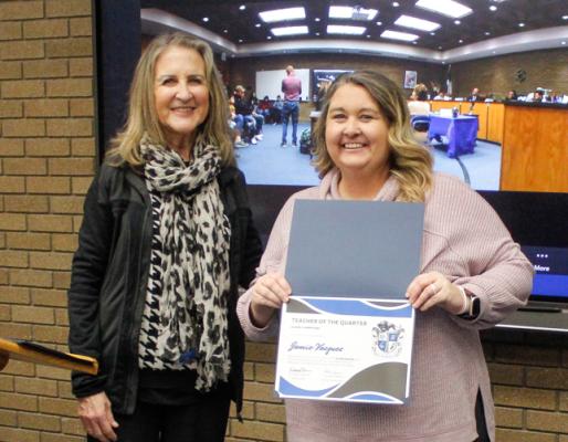 Alamo Assistant Principal Cathy Havins, left, honored the campus’ Teacher of the Quarter to Jamie Vazquez, a second grade teacher at the campus.