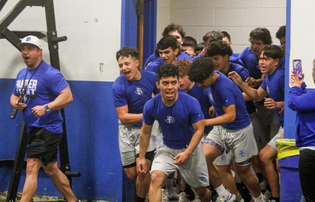 Fort Stockton head football coach Jeremy Hickman, far left, gave his team a pep talk before letting them loose for mat work in the final 15 minutes of their training session on Feb. 3 in the high school’s weight room. Photos by Nathan Heuer