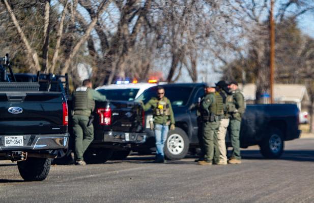Law enforcement vehicles surrounded the front of a residence on the 700 block of Dees Street on Feb. 10 during an execution of an arrest and search warrant. Photo by Nathan Heuer
