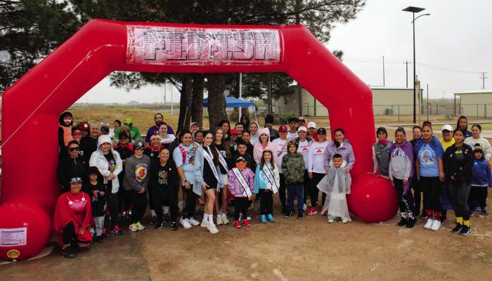 Runners in the First Annual Fort Stockton Autism Awareness Event pose for a post-race photo on Saturday, April 20.