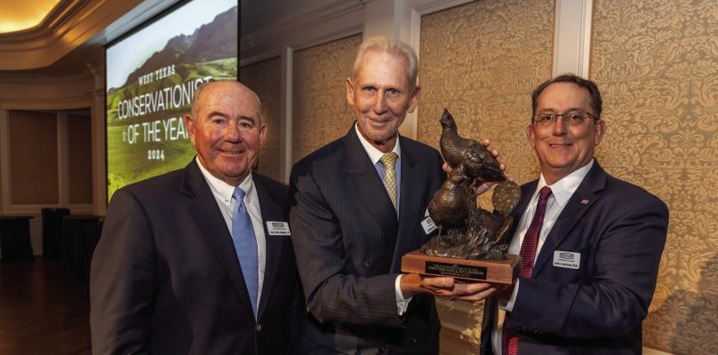 Presenting the award to Pointdexter (center) is BRI Advisory Board Chairman Dan Allen Hughes (left), and Director and founder of the Borderlands Research Institute, Dr. Louis Harveson.