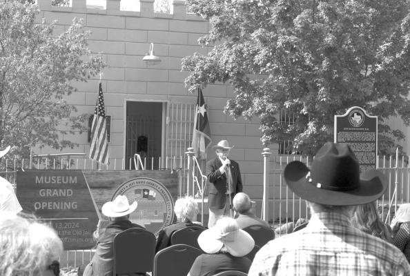 A gathering of local area law enforcement, the Fort Davis Chamber of Commerce the museum board, and retired Brewster County Sheriff Carl. C. Williams was present at the ribbon cutting for the newly opened Old Sheriffs Museum and Research Center in Fort Davis.