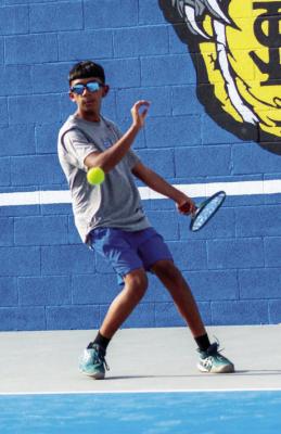 Miguel Lujan locks in on his return for Panther Tennis, reflecting the drive and focus fueling the Panthers this season. Photo by Karen Villanueva, Tumbleweed+