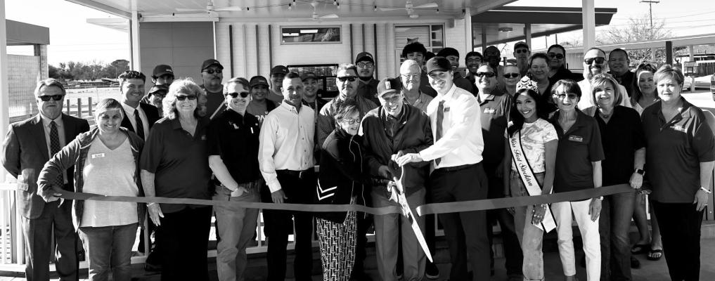 Members of the community gathered to celebrate Sonic’s grand re-opening and present a new official membership plaque to owners Travis and Tommie Lewis.