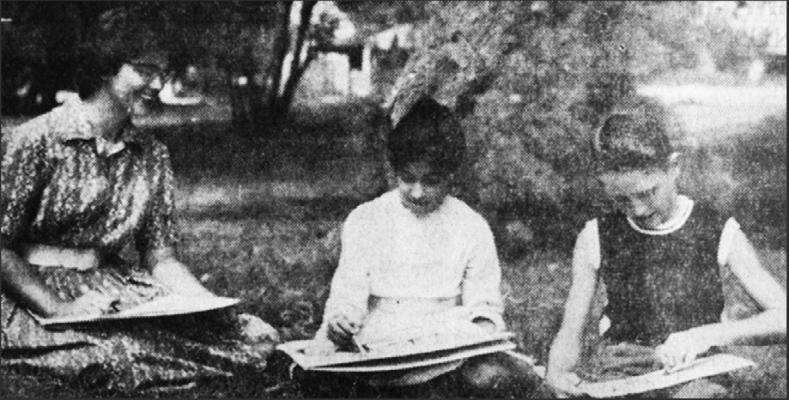 July 1961- SUMMERTIME is often art time! Mrs. Mary Frances Brown, summer recreational arts and crafts instructor, admires the etching being done by two of her students, Carrie Flores (center) and Ted Mc-Kenzie. (Pioneer Photo)