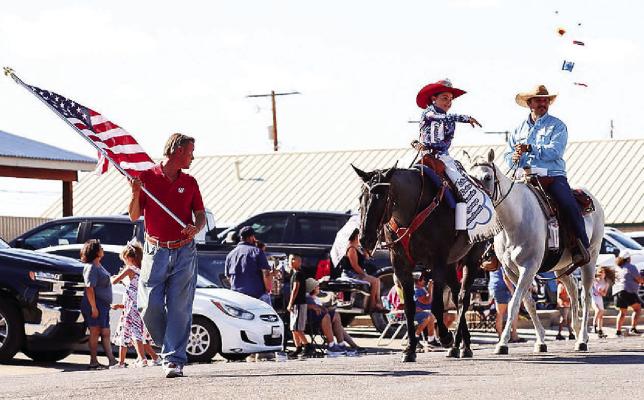 Miss Rodeo Comanche Springs Sweetheart 2023, Loretta Rivera, throws candy to paradegoers during Sunday’s 4th of July parade on Main Street. Photo by Shawn Yorks