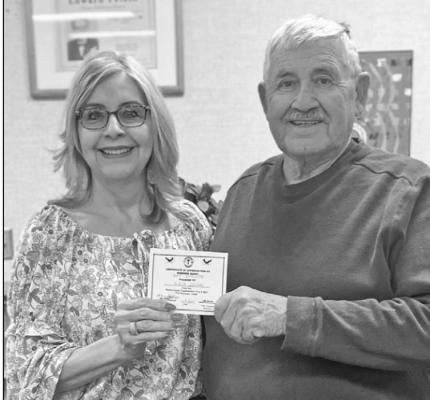 Alicia Salinas, left, received the Best Evaluator certificate from Oscar Gonzalez.