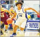 Aundre Washington drives the lane Nov. 28 against Kermit. File photo by Shawn Yorks