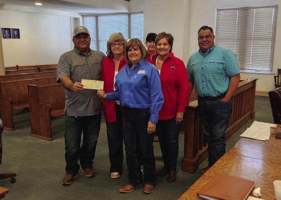 The Comanche Springs Rodeo donated $10,000 to the county for the Coliseum Arena improvements on Monday. Photo by Joh Covington