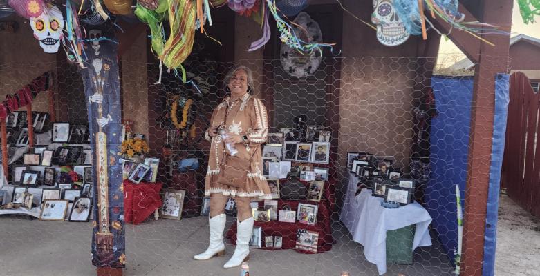 Sylvia Villalba lights candles in preparation for the Dia De Muertos festivities. Photo by Kerry Waldrip