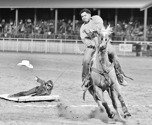 Pictured here is one cowboy participating in the hide race. Photo by Robby Freeman