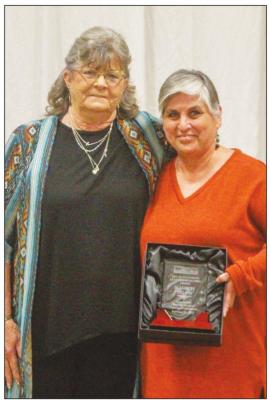 Jeanette Milam won the Outstanding Leadership Alumni Award and was gifted the plaque by Arna McCorkle.