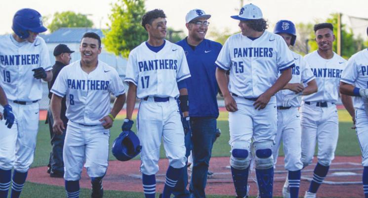 The Fort Stockton baseball team celebrates with Alfredo Molina (19) after his home run in the second inning of Friday’s contest against Seminole at home. Photo by Nathan Heuer