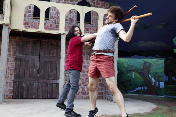 Mason Forringer (right), who stars as Robin Hood, and Cameron Owens, in the role of Little John, practice a fight scene at the Kokernot Outdoor Theatre. Courtesy Photo