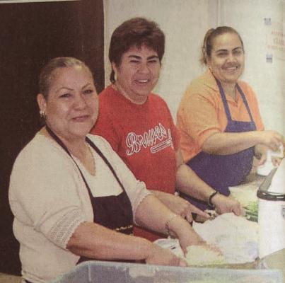 June 2006 - ENCHILADA LOVE – And enchilada dinner helps fund citizenship applicants. Cooks working on the enchilada luncheon, Norma Lujan, Lupita Sanchez, and Griselda Armendariz are pictured making the salad and side dishes. (Pioneer Photo)
