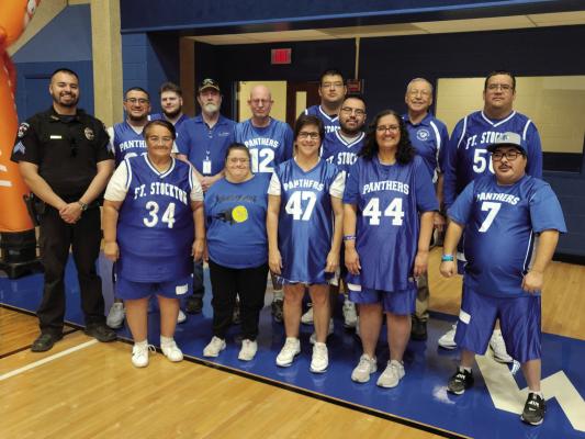 The Fort Stockton Special Olympics basketball team (pictured here with Sergeant Jordan Falcon) made a triumphant showing at the Area 18 Basketball Tournament in Midland, securing two victories in a bestof- three series while being supported by local law enforcement. Courtesy Photo
