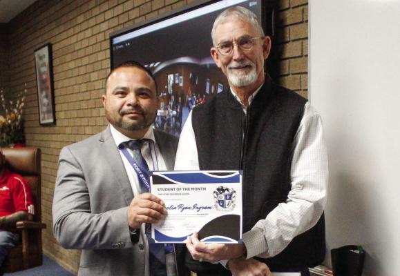 Fort Stockton Middle School Students of the month were Amelia Ingram (November) and Edaina Sanchez (December). Both were not pictured due to basketball games on their respective teams. Pictured is middle school principal Sammy Soliz, left, and Amelia’s father, who accepted the award on her behalf.