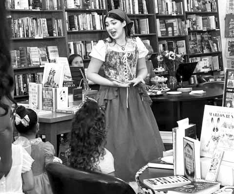 Cinderella made a musical visit to Front Street Books in Alpine last week, taking photos with kids and singing one of Rodgers and Hammerstein’s songs. Photo by Olivia Pertuso