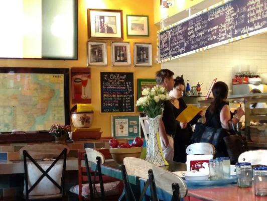 Customers ordering lunch at Café Brasil.