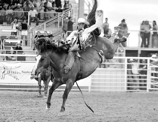Pro Rodeo’s Cole Frank takes a wild ride on Saturday. Photo by Robbie Freeman
