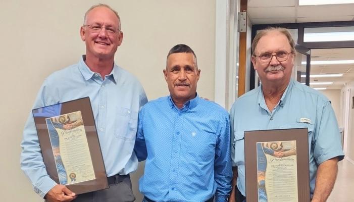 Mayor Paul Casias presented a proclamation recognizing Jeff Williams, left, and Patrick Blisnak, right, for their assistance and generosity during the situation. Courtesy Photo: Pioneer