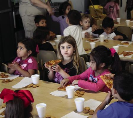 January 13, 2025 — As of January 27, Pecos County and Ward County each have 165 children signed up for the program, making them the leading counties in the Permian Basin and Trans-Pecos region. This success is a testament to the hard work of local organizations, educators, and families who recognize the importance of early literacy. Pictured here, kids from Tiny Tots Daycare celebrating their achievement with a pizza party.