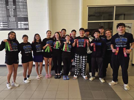 “They showed true grit and determination to swim faster,” said coach Lilia Forst after Blue Wave competed in a tough Region 1-4A Swim Meet this weekend. Courtesy Photo