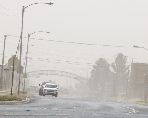 Traffic makes its way down North Main Street in Fort Stockton as blowing dust reduces visibility, Thursday afternoon. A Dust Storm warning was issued for the region as a wall of dirt, pushed along by 60 mph winds, moved from northwest to southeast. The dust storm was associated with the passage of a cold front and was followed by a 20-degree temperature drop within one hour and lows in the 30s by Friday morning. Photo by Shawn Yorks