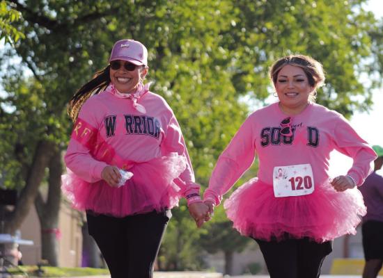 Hilda Vazquez, pictured here in the Warrior Squad Shirt and baseball hat, is a 5-year breast cancer survivor. She ran the 2024 5k with Patty Morales. Photo by Navieve Natividad