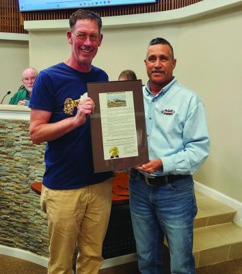 City History — Museum Director Ross Harper and City Mayor Paul Casias. Casias issued a proclamation commemorating the 70th Anniversary of the Annie Riggs Museum, designating November 20 as “Annie Riggs Museum 70th Anniversary Day.” Ross Harper, who received the proclamation, expressed gratitude for recognition. Pioneer Photo