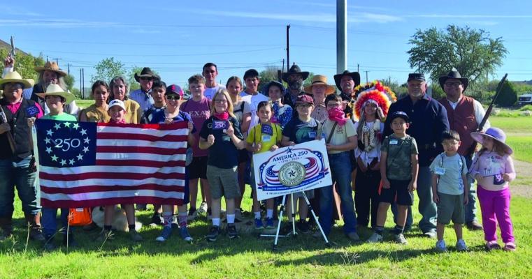 A group of volunteers who reenact scenes from the old west. One of their main roles in the community is honoring the protocol of retiring United States flags every Fourth of July. Photo by Ross Harper