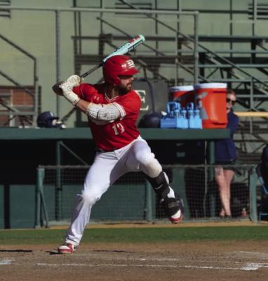 Catcher Corbin Montayne swings for the fences in the Lobos recent closeout series against St. Edwards Hilltoppers.