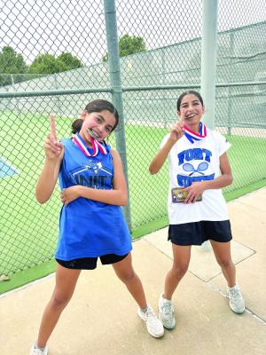 8th Grade Girls Doubles Champions, Alexsandra “Chana” Navarrette and Raquelle Jimenez, celebrate their success after a recent meet. Courtesy photo