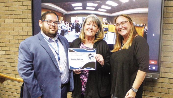 Andrea Johnson was named the Fort Stockton Intermediate Teacher of the Quarter at the district’s board meeting March 27 at the district’s administration building. Johnson teaches fourth grade math. Johnson was introduced and presented the award by intermediate principal Julian Castillo, left, and assistant principal Shannon O’Tierney.